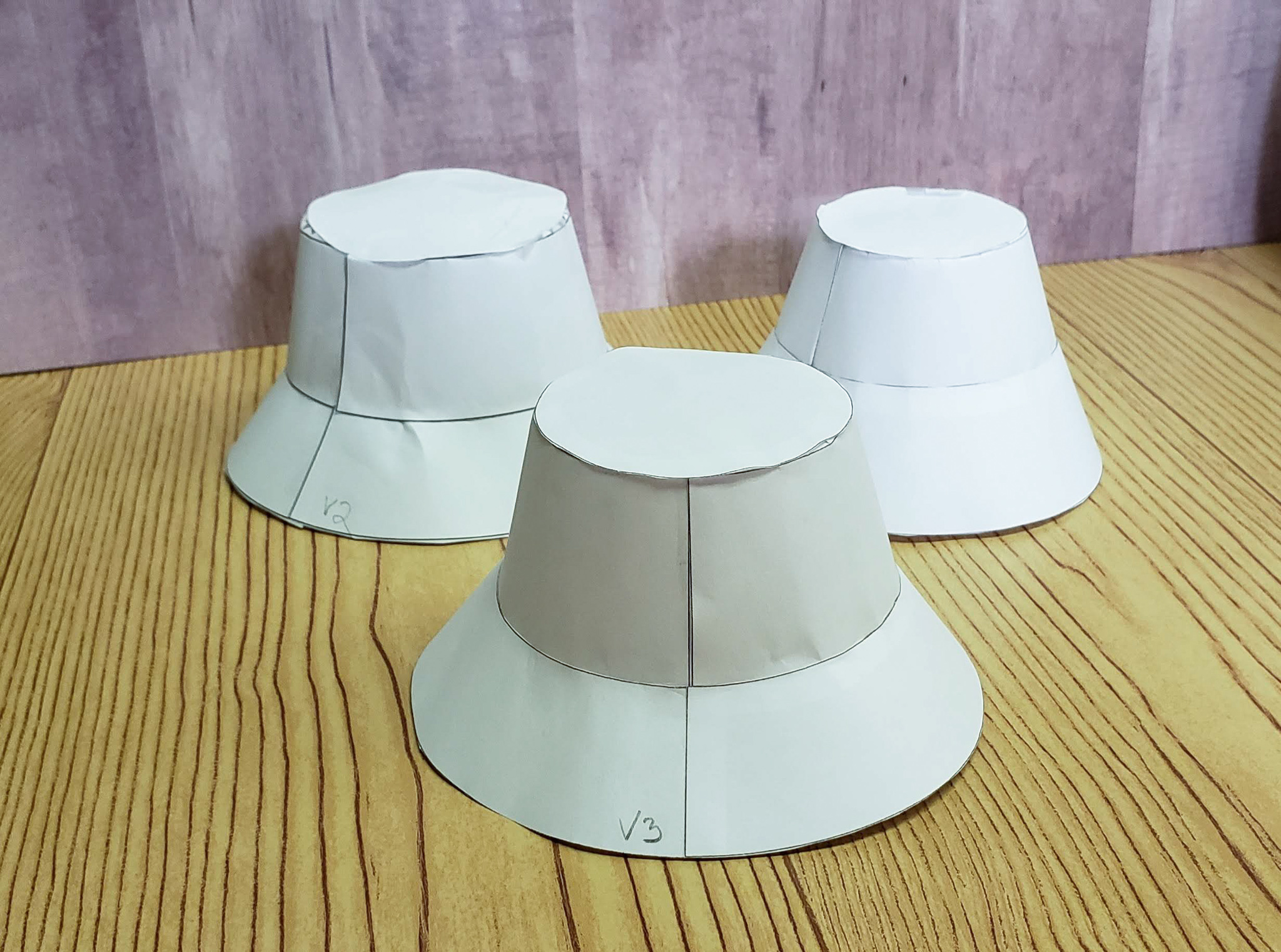 A photo of my three papercraft hats.