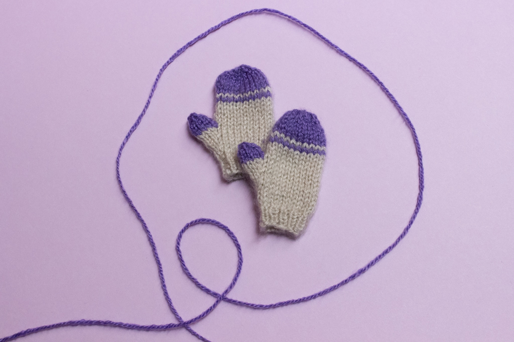 Finished pair of Smart Doll girl's knit mittens.