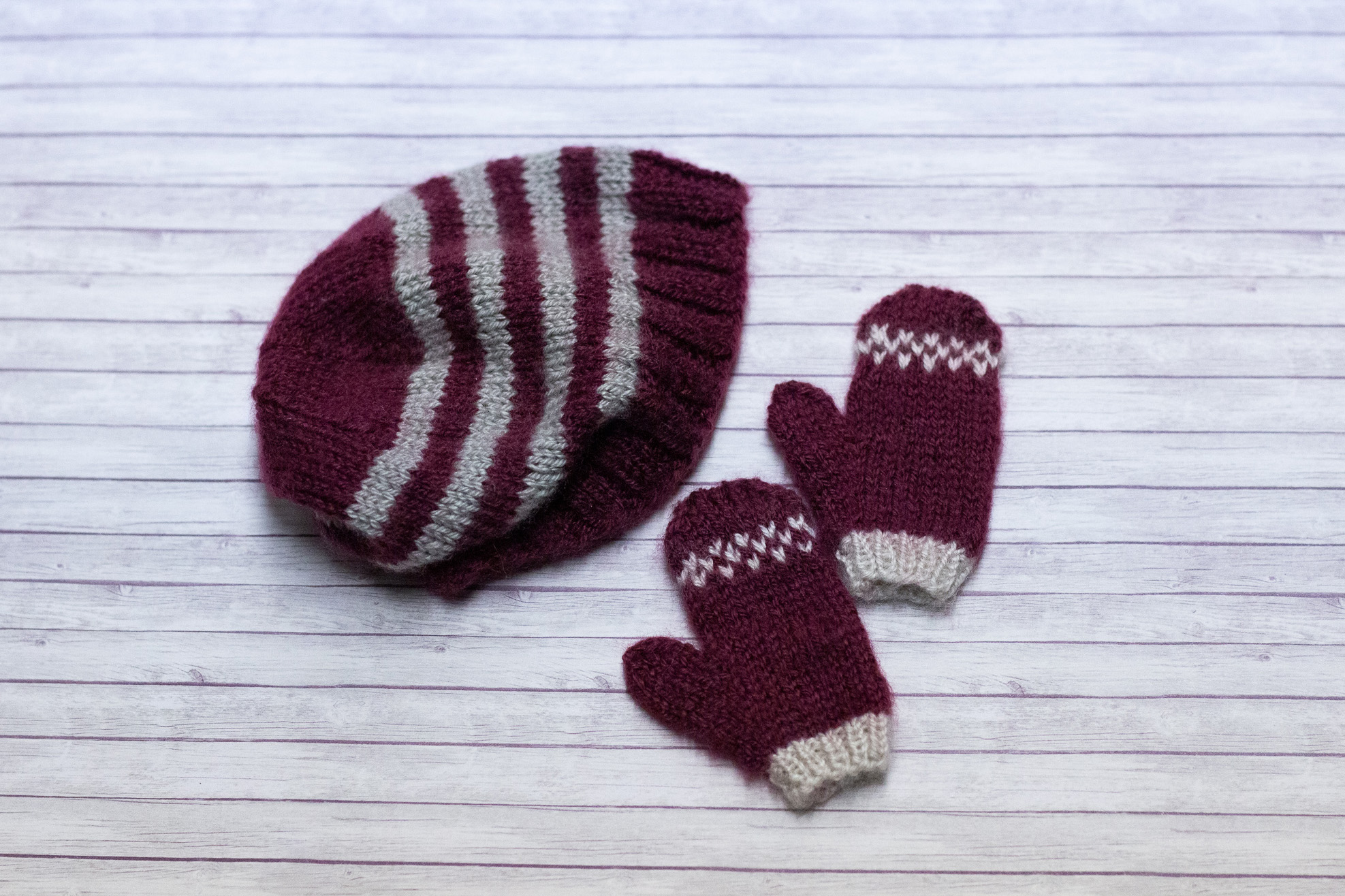 Striped hat with matching mittens.